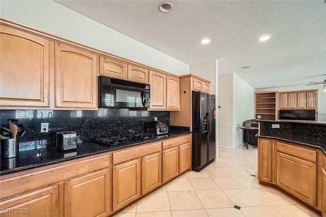 kitchen featuring black appliances, backsplash, dark stone countertops, a textured ceiling, and light tile patterned floors
