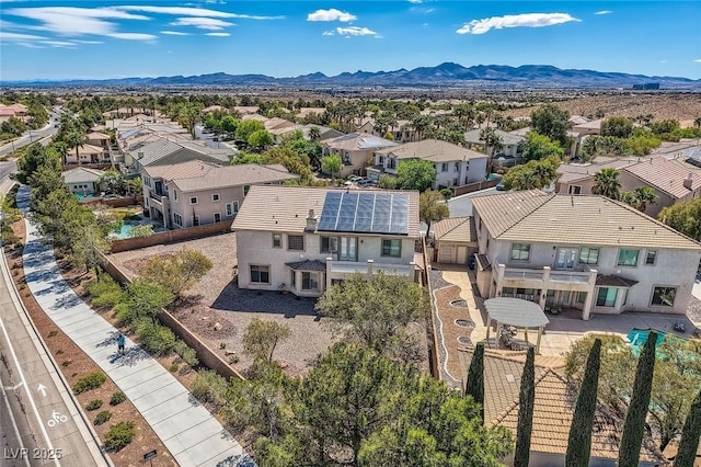 aerial perspective of suburban area featuring a mountain backdrop