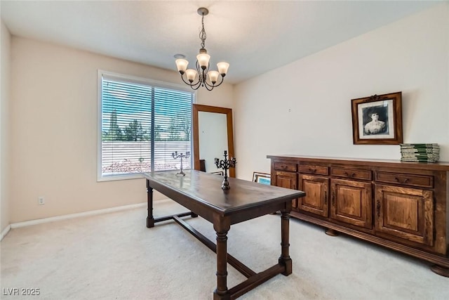 office space with light carpet, a chandelier, and baseboards