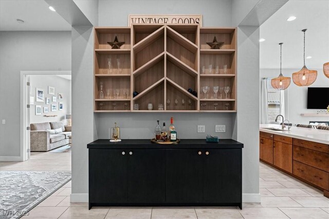 38 Costa Tropical Dr, Henderson, NV 89011 - indoor dry bar featuring baseboards, recessed lighting, light tile patterned flooring, and decorative light fixtures