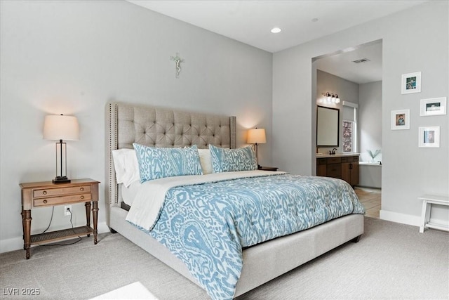 38 Costa Tropical Dr, Henderson, NV 89011 - bedroom with carpet, ensuite bathroom, baseboards, recessed lighting, and a sink