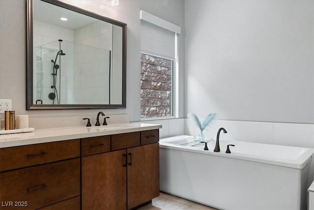 38 Costa Tropical Dr, Henderson, NV 89011 - full bathroom with a shower stall, a freestanding tub, and vanity