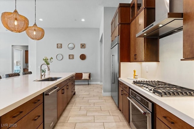 38 Costa Tropical Dr, Henderson, NV 89011 - kitchen with a sink, appliances with stainless steel finishes, wall chimney range hood, light countertops, and recessed lighting