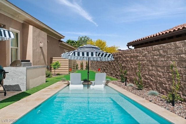 38 Costa Tropical Dr, Henderson, NV 89011 - view of pool with a fenced backyard, an outdoor kitchen, and a patio