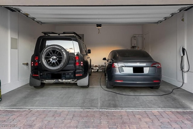 38 Costa Tropical Dr, Henderson, NV 89011 - garage with water heater and a garage door opener