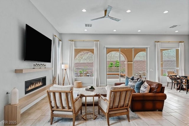 38 Costa Tropical Dr, Henderson, NV 89011 - living area with recessed lighting, a glass covered fireplace, and ceiling fan