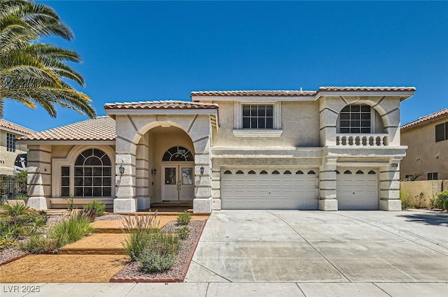 9208 November Breeze St, Las Vegas, NV 89123 - mediterranean / spanish home featuring french doors, stucco siding, a tiled roof, a garage, and concrete driveway