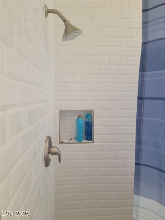 bathroom view of tiled shower