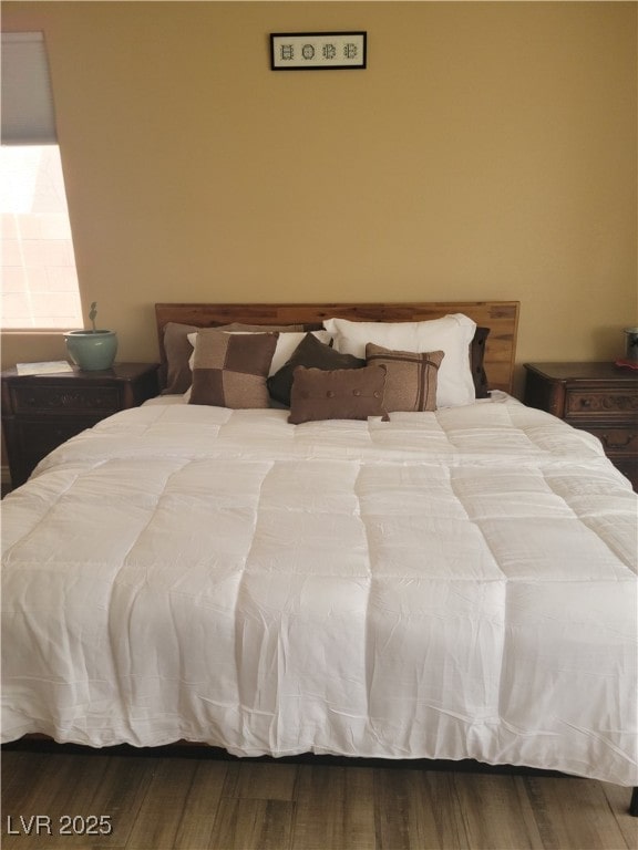 bedroom with wood finished floors