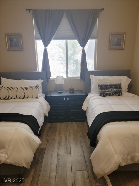bedroom with wood finished floors