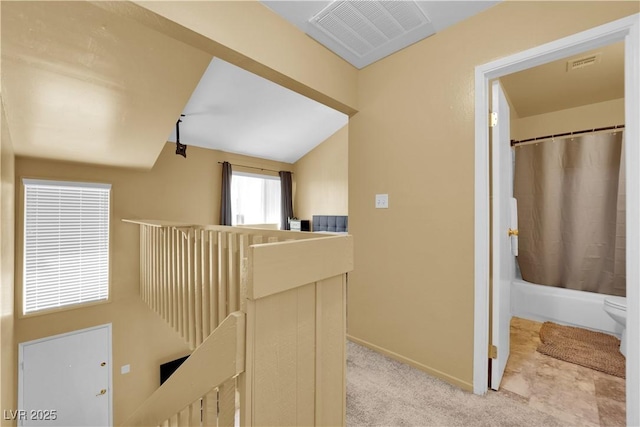 4770 Topaz St Unit 108, Las Vegas, NV 89121 - corridor featuring an upstairs landing, baseboards, and light carpet