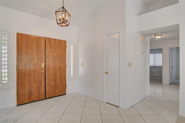 6432 Jean Lee Dr, Las Vegas, NV 89108 - entryway featuring light tile patterned flooring and a chandelier