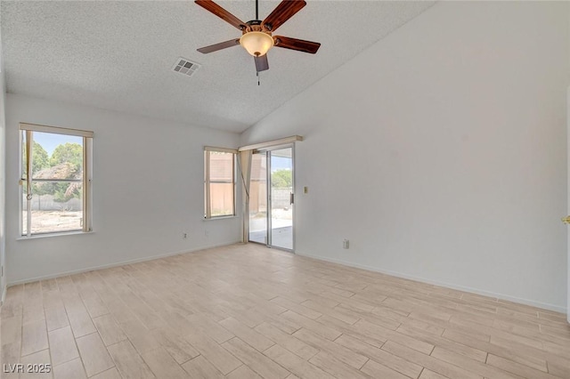 6432 Jean Lee Dr, Las Vegas, NV 89108 - spare room featuring ceiling fan, a textured ceiling, light wood finished floors, baseboards, and high vaulted ceiling
