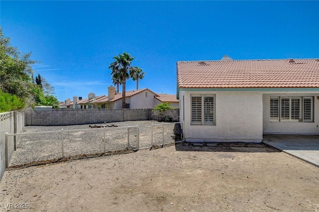 6432 Jean Lee Dr, Las Vegas, NV 89108 - fenced backyard with a patio area