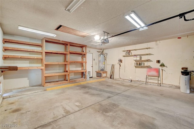 6432 Jean Lee Dr, Las Vegas, NV 89108 - garage featuring water heater and a garage door opener