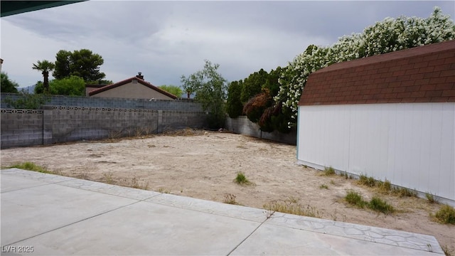 6432 Jean Lee Dr, Las Vegas, NV 89108 - view of yard featuring a patio and an outdoor structure