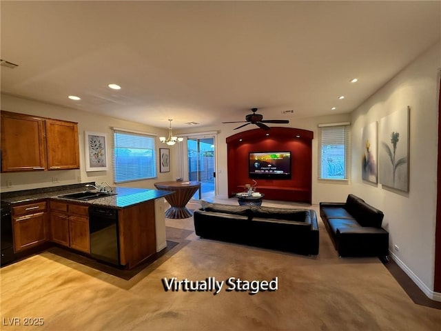 5019 Quiet Falls Ct, Las Vegas, NV 89141 - kitchen featuring black dishwasher, dark countertops, brown cabinets, recessed lighting, and a ceiling fan