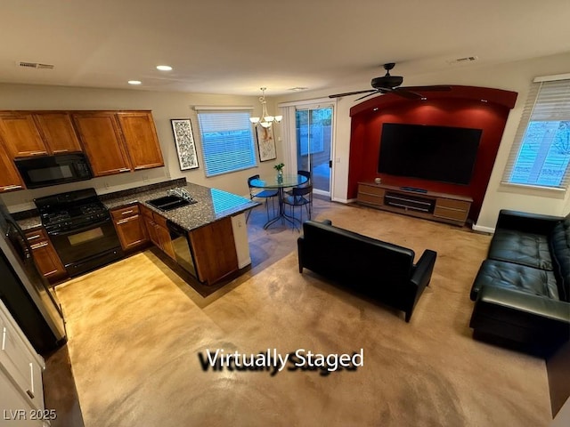 5019 Quiet Falls Ct, Las Vegas, NV 89141 - kitchen with black appliances, brown cabinets, a chandelier, a peninsula, and ceiling fan