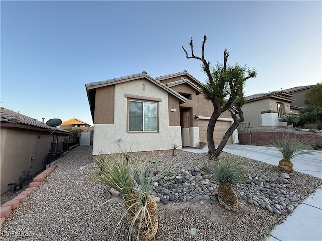 5019 Quiet Falls Ct, Las Vegas, NV 89141 - view of front of home with a garage, stucco siding, a tiled roof, and concrete driveway