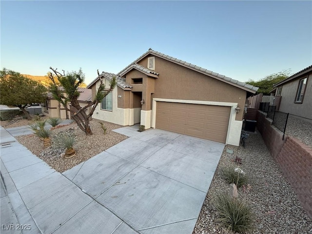5019 Quiet Falls Ct, Las Vegas, NV 89141 - view of front of home featuring stucco siding, a garage, concrete driveway, and a tile roof