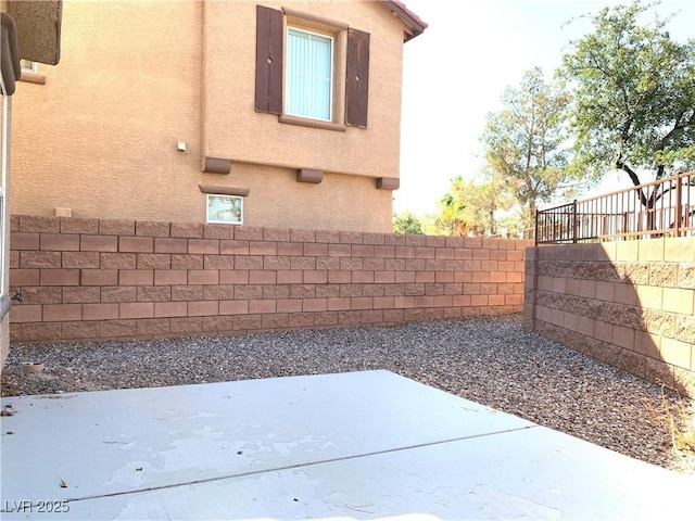 fenced backyard featuring a patio