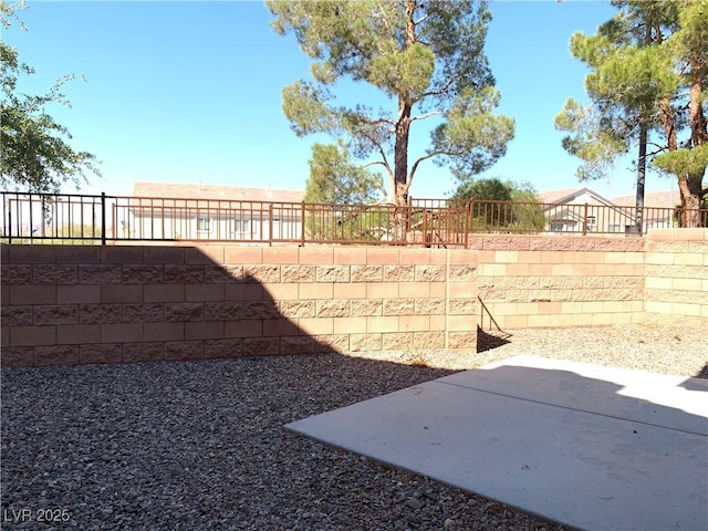 fenced backyard with a patio