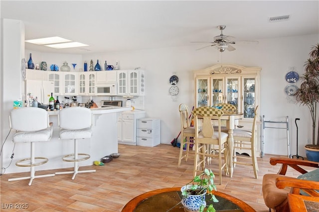 1223 Golf Club Dr, Laughlin, NV 89029 - living room with a ceiling fan and light wood finished floors