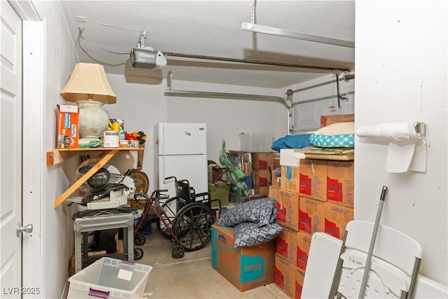 1223 Golf Club Dr, Laughlin, NV 89029 - garage featuring freestanding refrigerator and a garage door opener