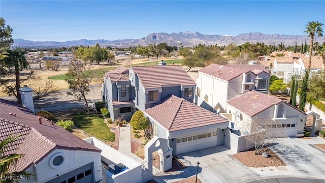 aerial view of residential area with a mountainous background