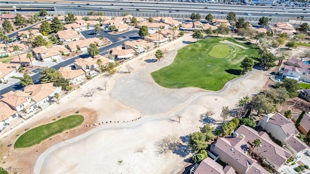 aerial view of property and surrounding area with nearby suburban area and a golf club
