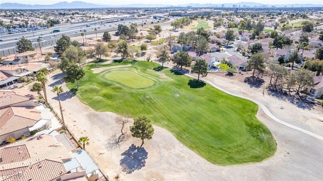 aerial overview of property's location featuring mountains, nearby suburban area, and a golf club