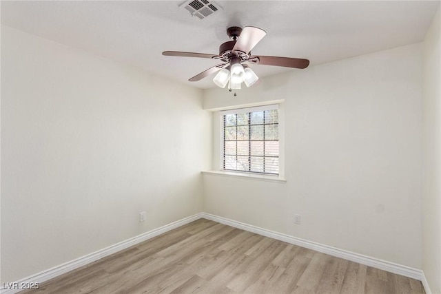 unfurnished room with light wood-style flooring, baseboards, and a ceiling fan