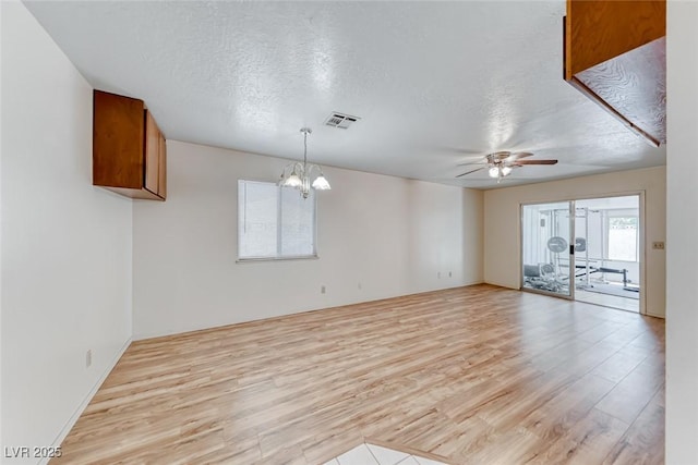 729 Scottsdale St, Henderson, NV 89002 - unfurnished room with light wood-type flooring, a chandelier, a textured ceiling, and ceiling fan