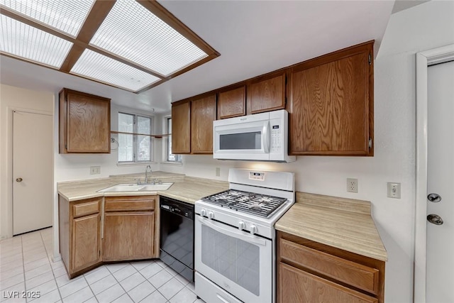 729 Scottsdale St, Henderson, NV 89002 - kitchen with white appliances, a sink, light countertops, and light tile patterned floors