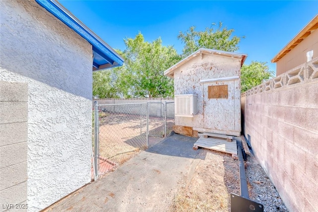 729 Scottsdale St, Henderson, NV 89002 - gate featuring fence, a shed, and an outdoor structure