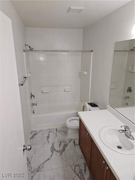 7461 Enviable Ct, Las Vegas, NV 89149 - full bathroom featuring marble finish flooring, bathtub / shower combination, vanity, a textured ceiling, and toilet