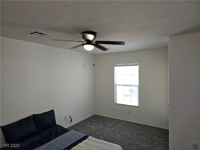 7461 Enviable Ct, Las Vegas, NV 89149 - bedroom featuring dark carpet, a ceiling fan, and baseboards