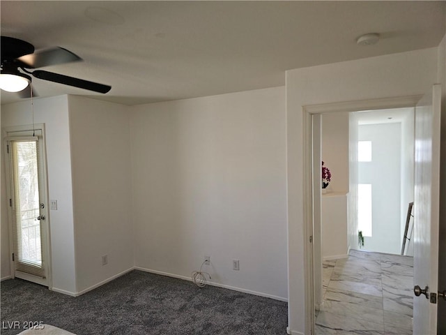 7461 Enviable Ct, Las Vegas, NV 89149 - empty room featuring ceiling fan, a smoke detector, baseboards, and dark colored carpet