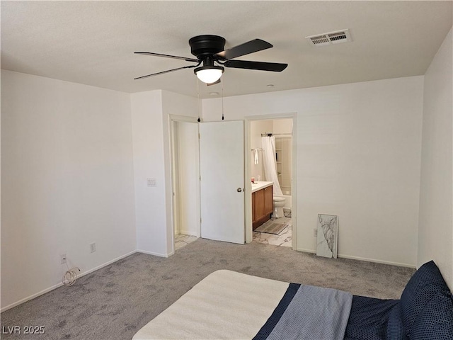 7461 Enviable Ct, Las Vegas, NV 89149 - bedroom featuring light carpet, baseboards, ensuite bath, and ceiling fan