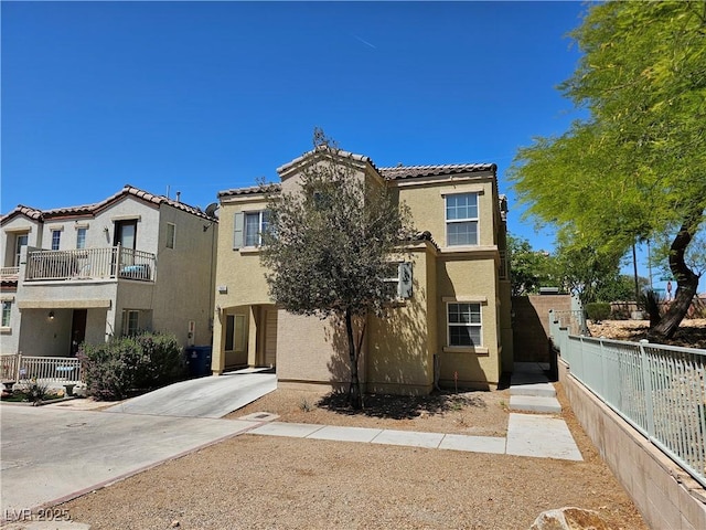 7461 Enviable Ct, Las Vegas, NV 89149 - view of front facade featuring stucco siding, fence, a tile roof, and a balcony