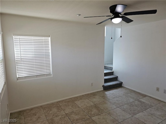7461 Enviable Ct, Las Vegas, NV 89149 - empty room with ceiling fan, tile patterned floors, stairs, and baseboards