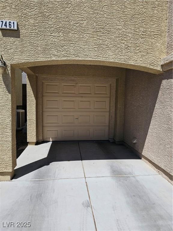 7461 Enviable Ct, Las Vegas, NV 89149 - garage featuring central AC unit and concrete driveway