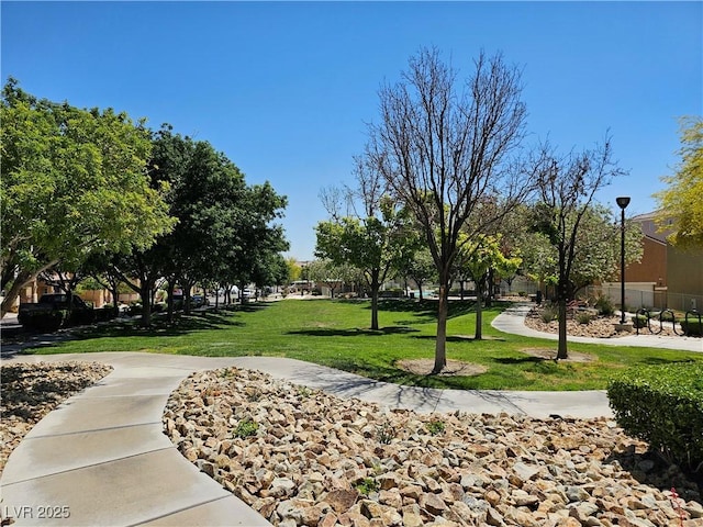7461 Enviable Ct, Las Vegas, NV 89149 - view of community with a yard