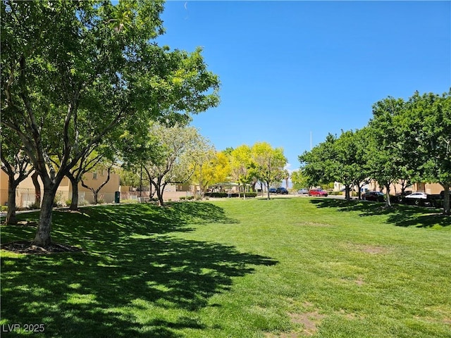 7461 Enviable Ct, Las Vegas, NV 89149 - view of home's community with a lawn