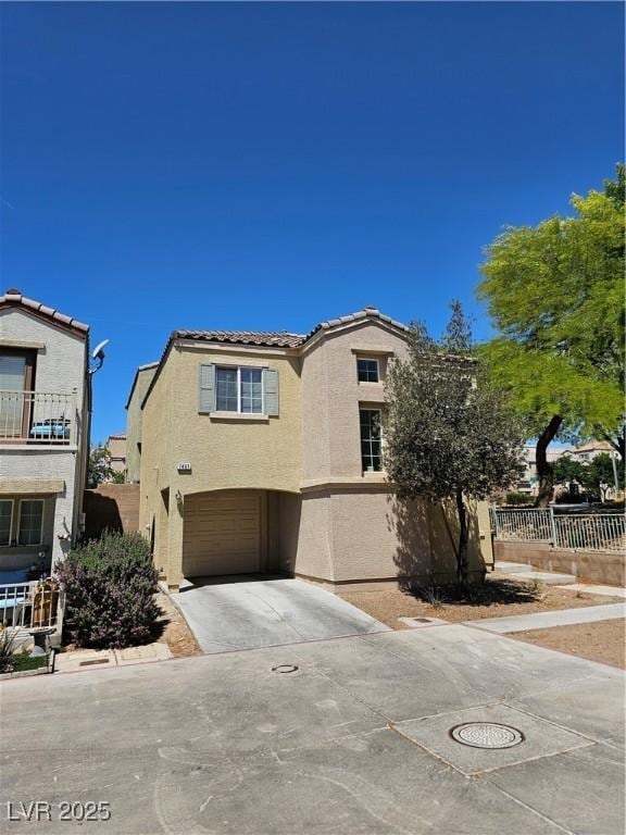 7461 Enviable Ct, Las Vegas, NV 89149 - view of front of property with concrete driveway, a garage, stucco siding, a tiled roof, and fence