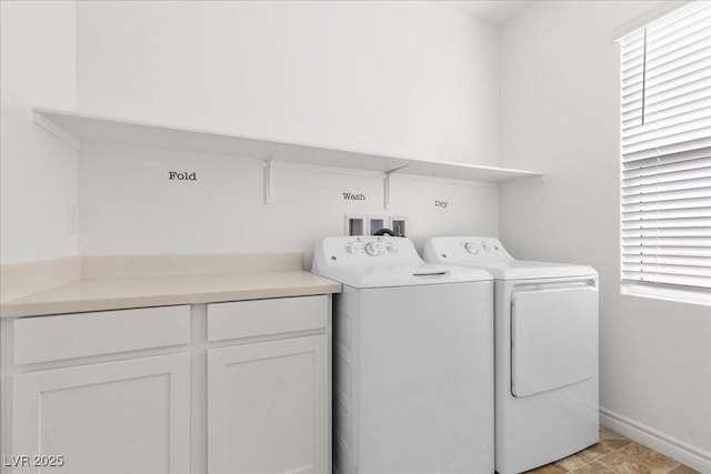 6854 Chargehand Ave, Las Vegas, NV 89156 - laundry room featuring washing machine and dryer, healthy amount of natural light, and baseboards
