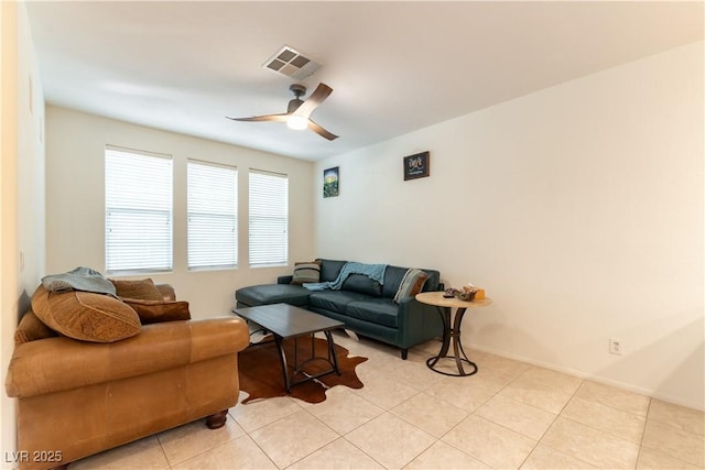 9986 Sand Key St, Las Vegas, NV 89178 - living area with ceiling fan, light tile patterned floors, and baseboards