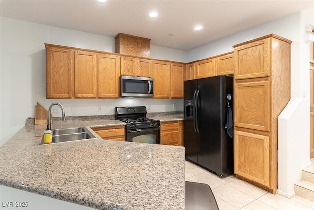 9986 Sand Key St, Las Vegas, NV 89178 - kitchen featuring black appliances, a sink, a peninsula, light tile patterned flooring, and light stone countertops