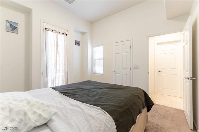 9986 Sand Key St, Las Vegas, NV 89178 - bedroom featuring light colored carpet and light tile patterned floors