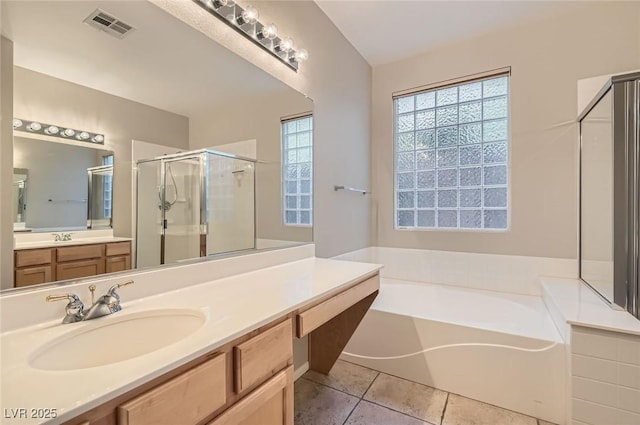 10212 Donald Weese Ct, Las Vegas, NV 89129 - bathroom featuring a shower stall, a bath, vanity, and tile patterned floors